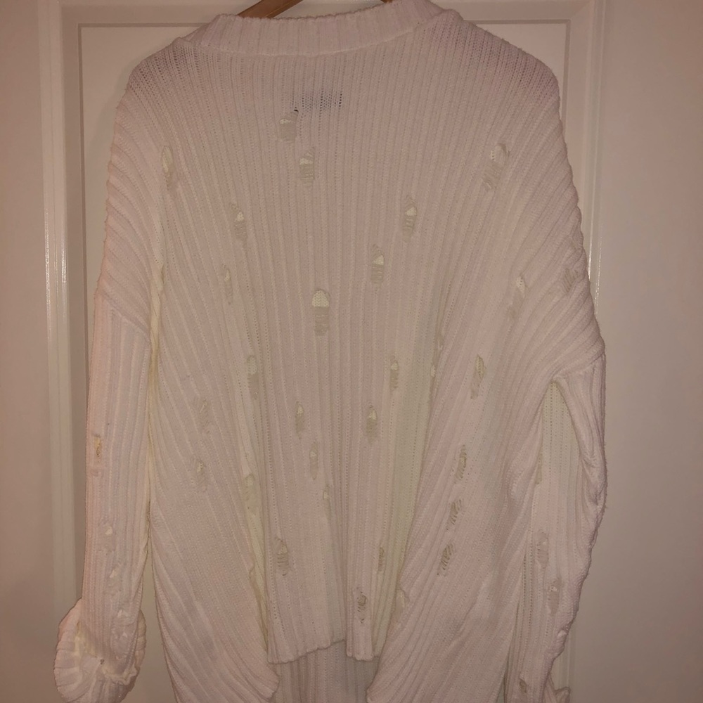 Holey high low sweater !